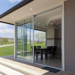 glazed terrace in the countryside with sliding glass